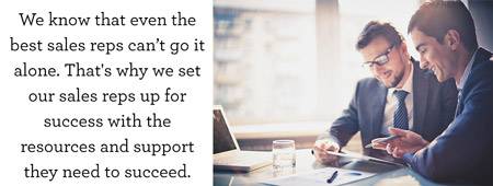 Two businessmen at office table; We know that even the best sales reps can't go it alone. That's why we set our sales reps up for success with the resources and support they need to succeed.