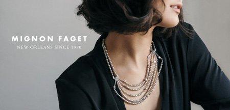 Mignon Faget woman in black top neckline with jeweled necklace